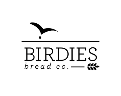 Logo of Birdies Bread Co. with a stylized bird and bread loaf on a white background