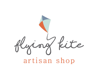 Logo of 'Flying Kite Artisan Shop' with a colorful kite illustration on a white background.